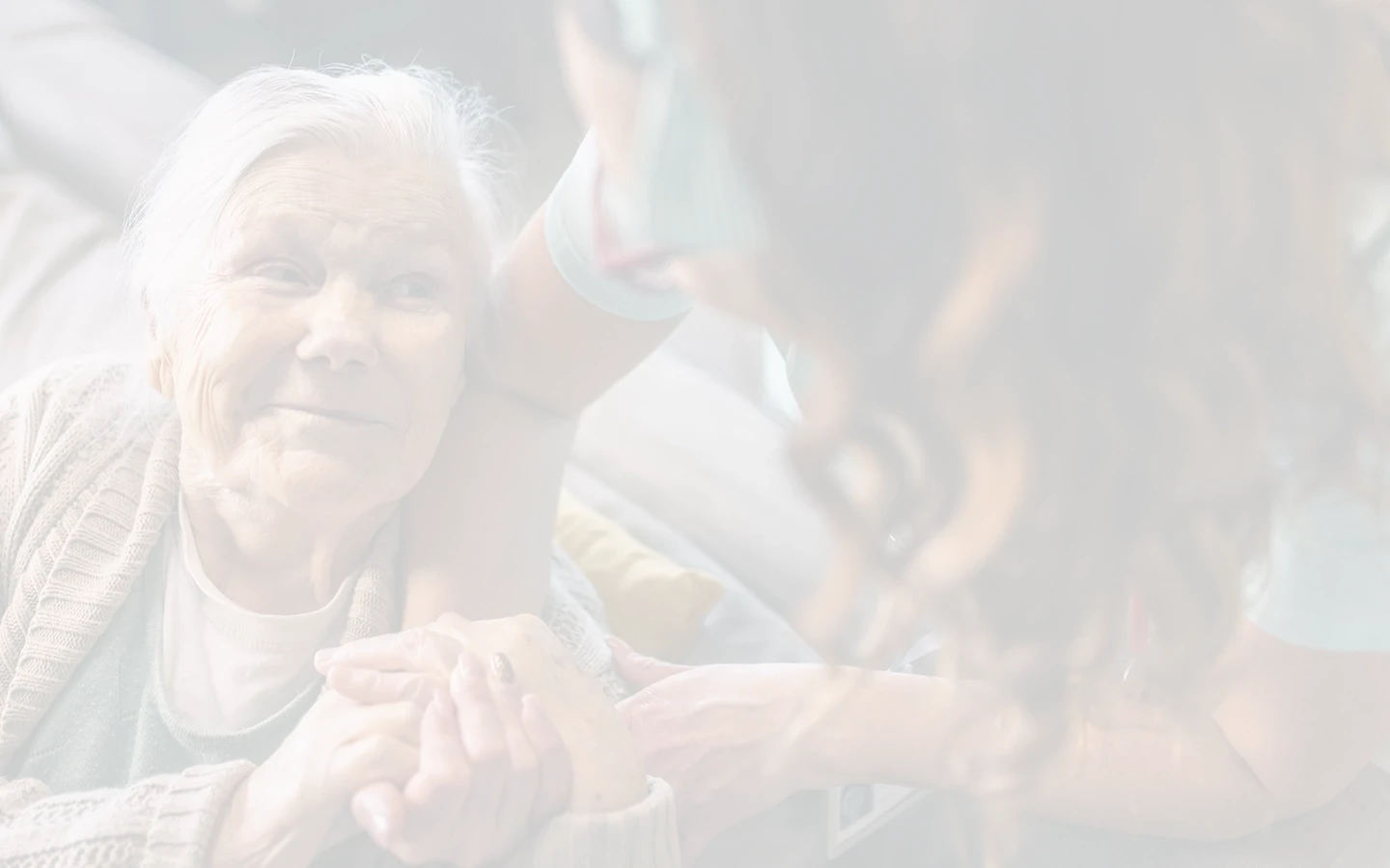 Client and caregiver holding hands