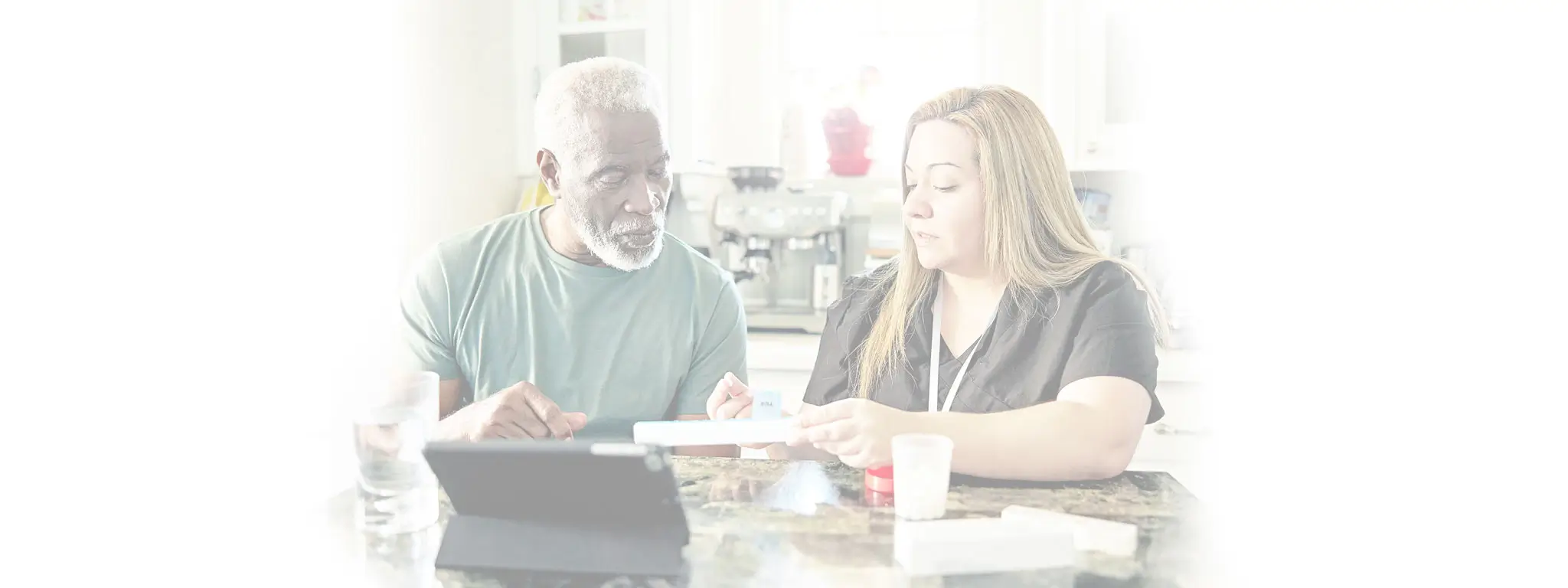Caregiver going over medications with client